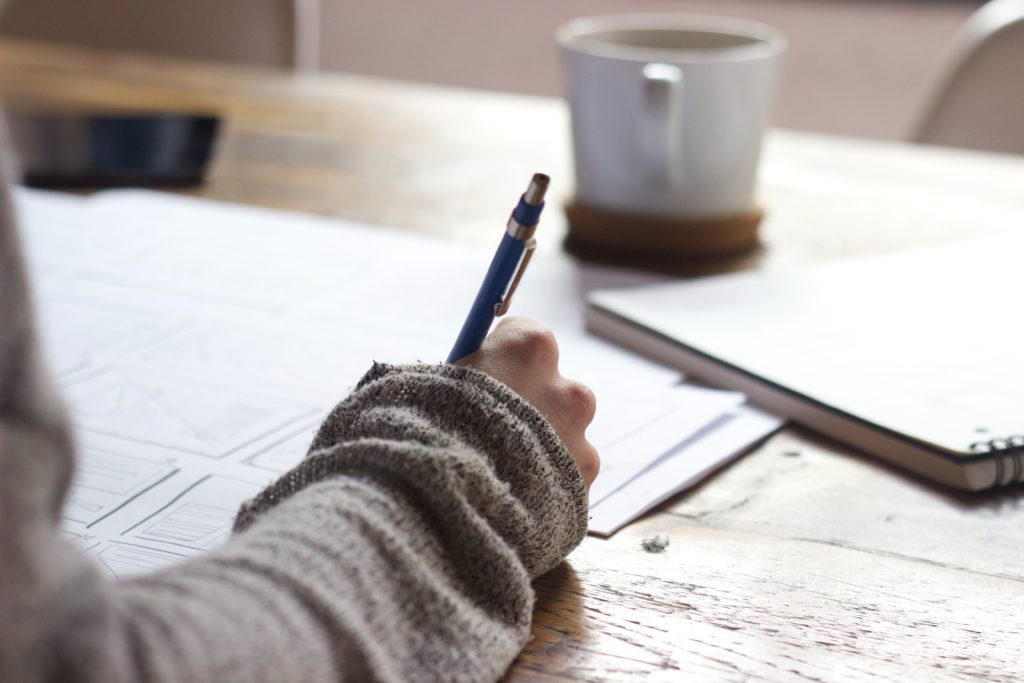 writing on paper with tea